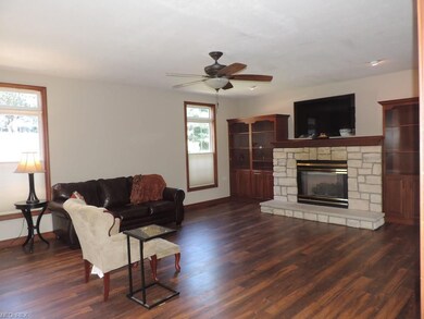 This family room has Cherry built in cabinetry and