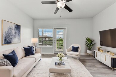 Living room with light wood-type flooring, basebo