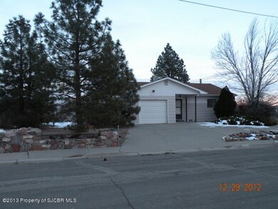 Front with more yard view