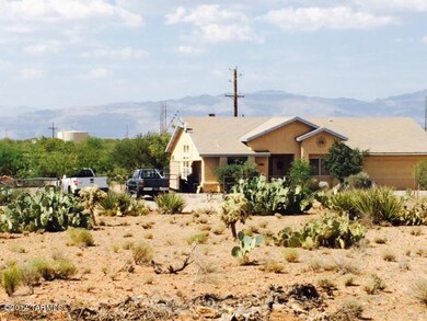 Neighboring house, mountains in distance