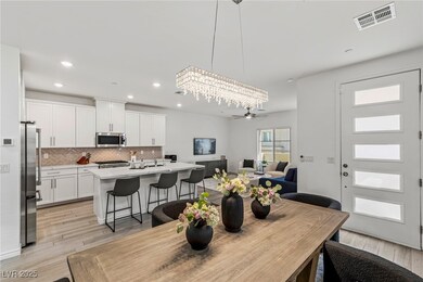 Dining room with recessed lighting, visible vents,