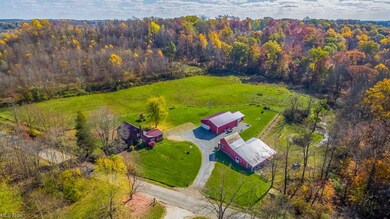 Beautiful acreage with a garage and a bank barn!