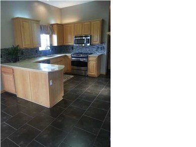 KITCHEN WITH MARBLE COUNTERTOPS