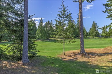 This is the views of the Port Ludlow golf course from the main living room, dining, room and primary bedroom. West-facing for afternoon sun and sunsets, this manicured and peaceful view can be yours!
