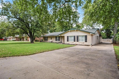 Ranch-style house with a front lawn