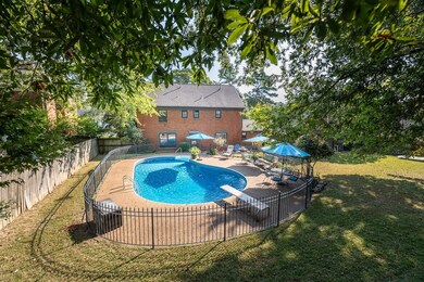 View of pool with a patio area, a gazebo, a diving