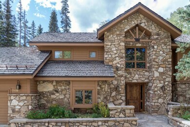 Front with heated driveway & sidewalk