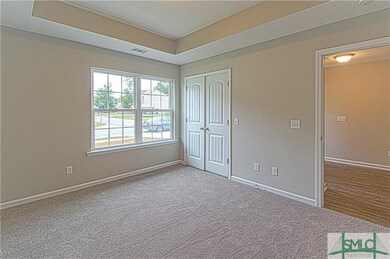 front bedroom with trey ceiling