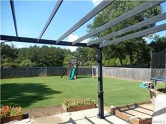 Backyard view with play set.