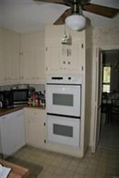 Another kitchen view showing double ovens