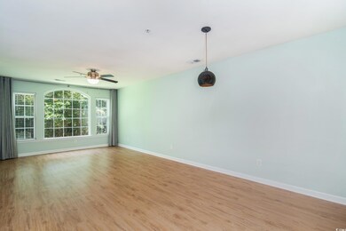 Unfurnished room featuring light wood finished floors and ceiling fan