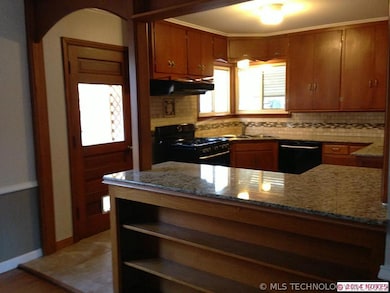 Open kitchen plan with original art deco lighting