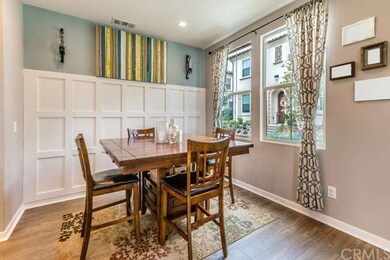Light and bright dining area with beautiful wainsc