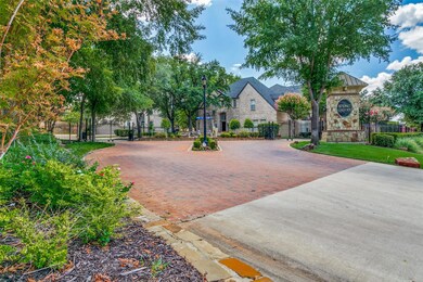 Lovely brick paved entrance to this gated paradise community.