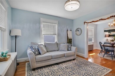 Living room with an inviting chandelier, radiator,