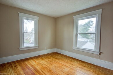 Large living room area of 2nd floor unit. Vinyl re
