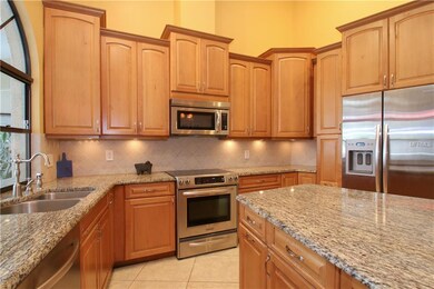 A completely renovated kitchen showcases granite c