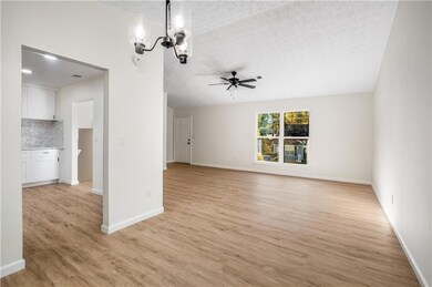 Unfurnished living room featuring light wood finis