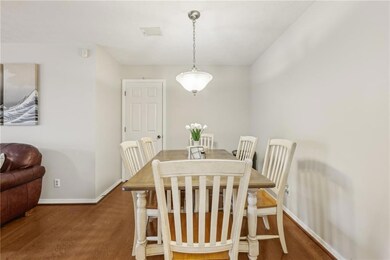 Dining space with wood finished floors and baseboards