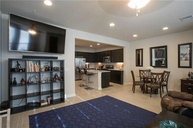 Living room with recessed lighting and light wood