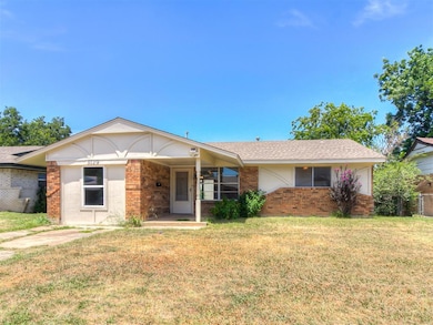 Ranch-style home with a front yard
