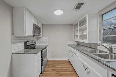 Kitchen featuring a sink, stainless steel applianc