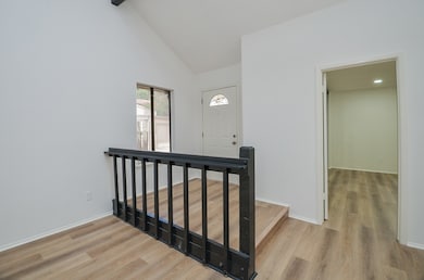 The entryway welcomes you with high ceilings, inst