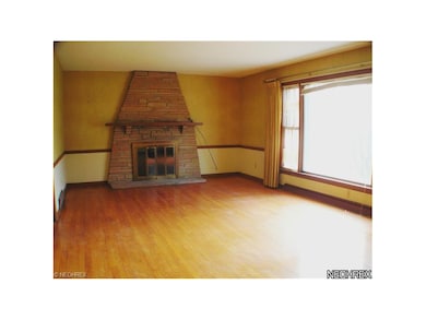 Living room overlooks wooded back yard...