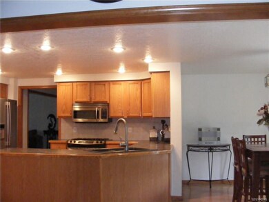 Bright open concept kitchen flows to the breakfast