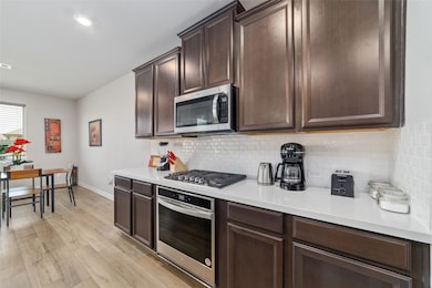 Kitchen has plenty of cabinet storage space.
