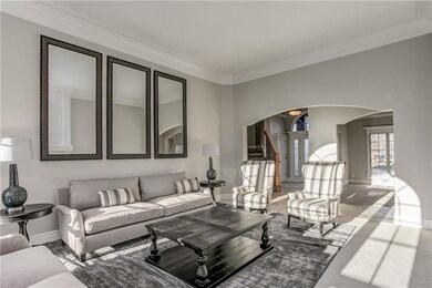 High ceilings, wide crown moulding, and wide arche