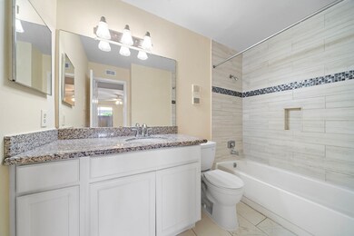 Private bathroom with granite counter and updated