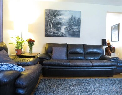 This living room is warm and inviting.  Its proxim