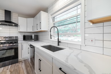 The large window over the sink conveniently overlo