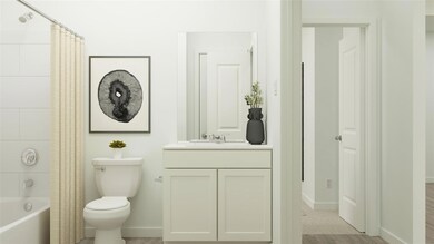 Bathroom featuring baseboards, shower / bathtub co