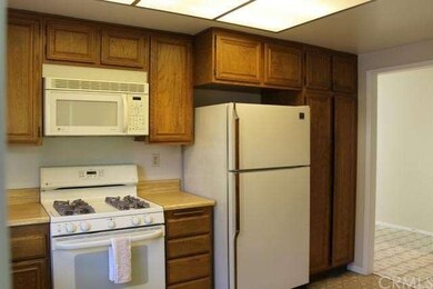 Second view of kitchen. Small kitchen nook to righ