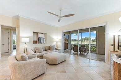 Living room featuring crown molding, a ceiling fan, and plenty of natural light