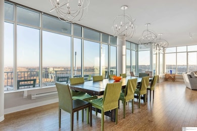 There are 3 amazing walls of windows facing east, north & south & views downtown to the west as well in this spectacular open concept floor plan. There are 2 living areas, each with fantastic fireplaces & a huge kitchen & dining area in between & wine bar