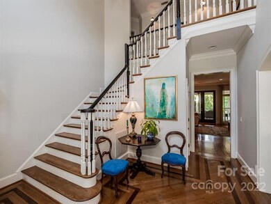 Two Story Foyer With Hardwood Floors & Custom Inla