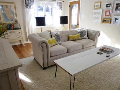 Large front window floods the living room with nat
