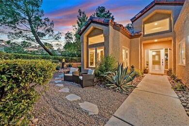 Doorway to property featuring stucco siding, a til