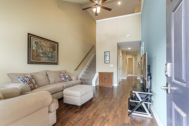 Living area with hardwood laminate and a gorgeous accent wall