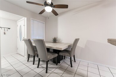 Dining space featuring a ceiling fan and baseboard