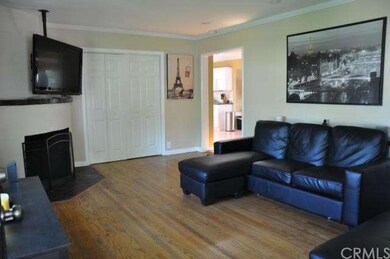Living Room w/Fireplace.  Trifold Doors Lead to St