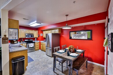 Kitchen featuring stainless steel appliances. Dining area.
