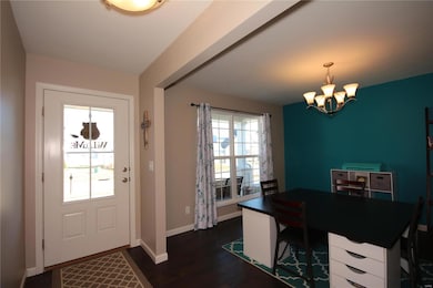 Looking back to front door and into the dining room
