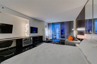 Bedroom featuring expansive windows