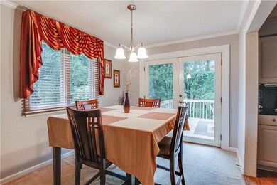 This fabulous dining room offers french doors that