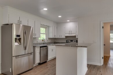 13x11 Renovated Kitchen has new appliances and custom tile work.