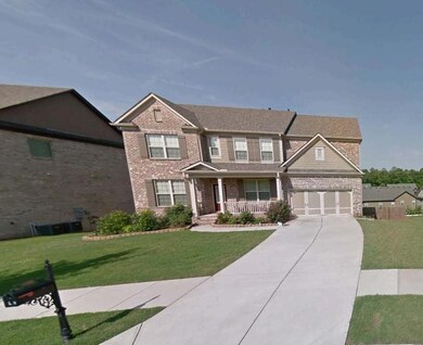View of front of house featuring brick siding, a p